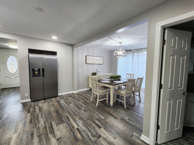 dining room featuring a chandelier, hardwood / wood-style flooring, and a wealth of natural light