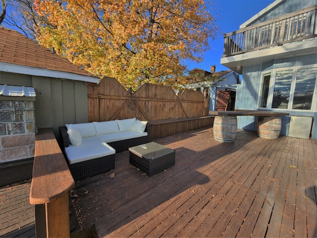 wooden terrace with an outdoor hangout area