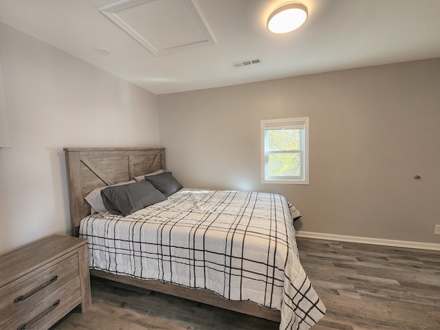 bedroom featuring dark hardwood / wood-style flooring