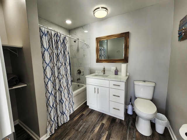 full bathroom featuring vanity, shower / tub combo with curtain, toilet, and hardwood / wood-style floors