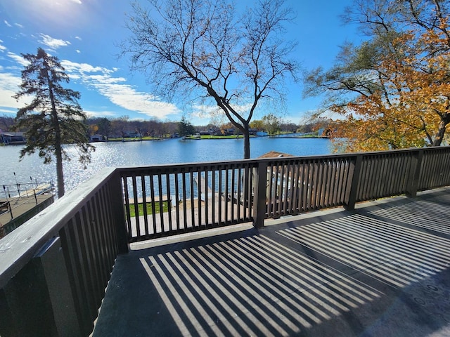 wooden terrace with a water view