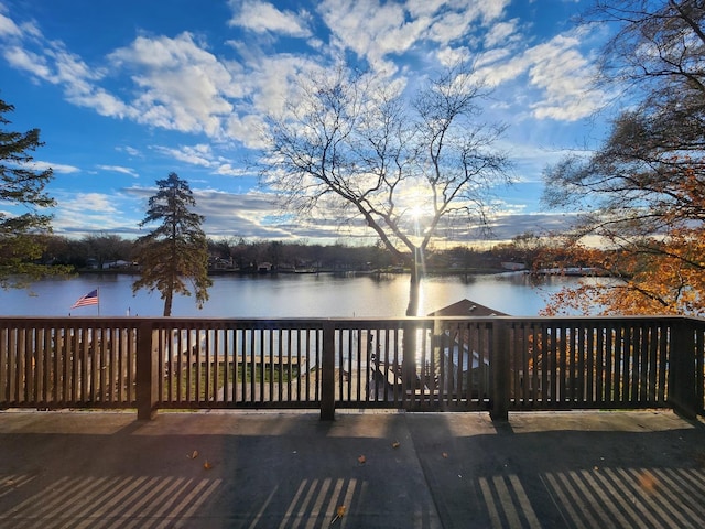 wooden deck featuring a water view