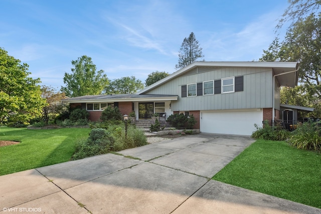 tri-level home with a front lawn and a garage