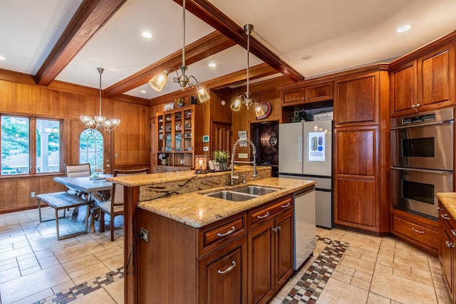 kitchen with sink, stainless steel appliances, beamed ceiling, and wooden walls