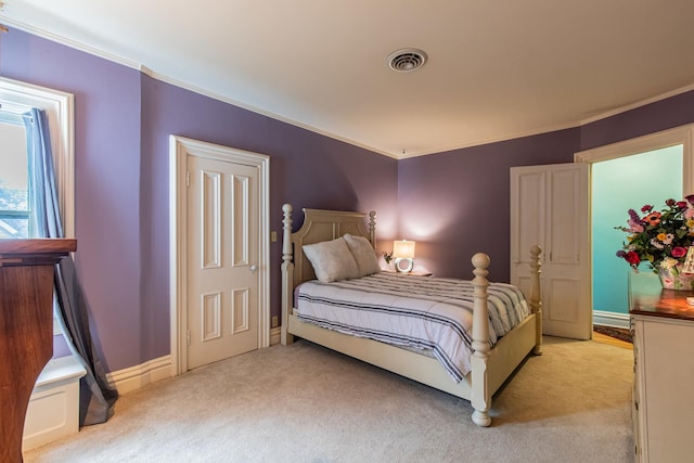 carpeted bedroom with crown molding