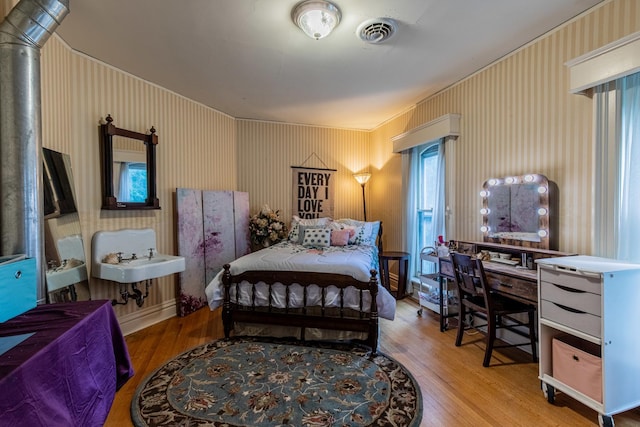 bedroom featuring hardwood / wood-style floors