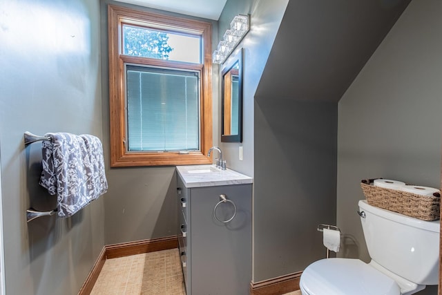 bathroom featuring toilet and vanity