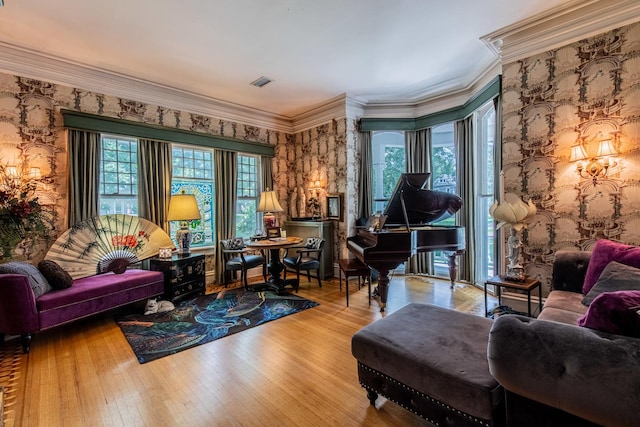 living area featuring crown molding and light wood-type flooring