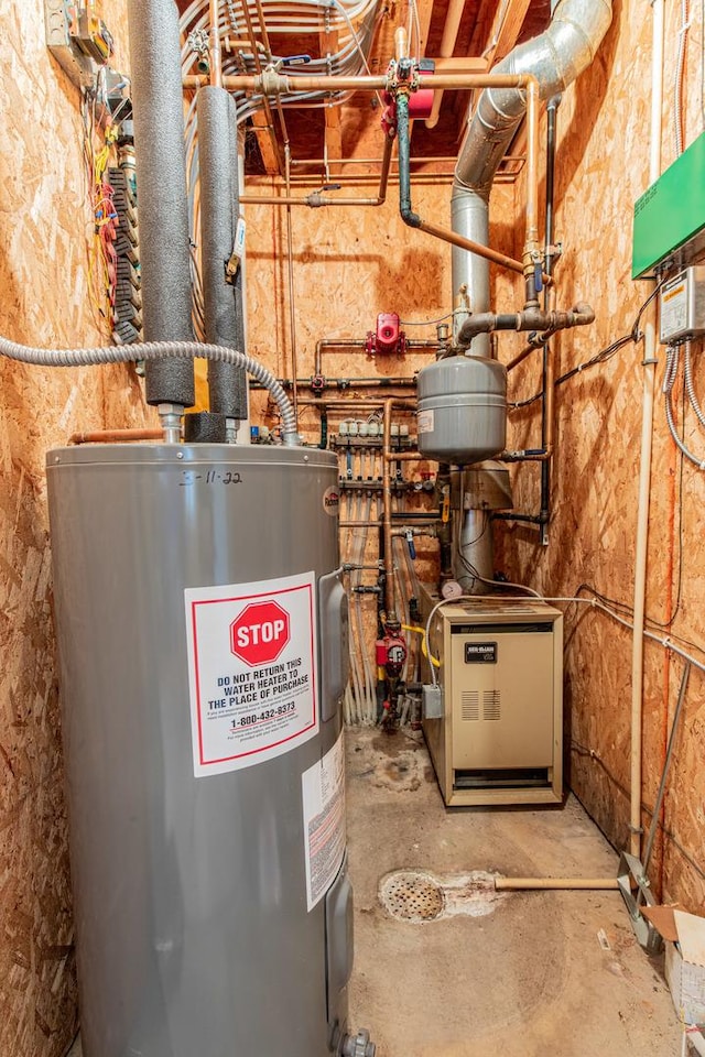 utility room with electric water heater