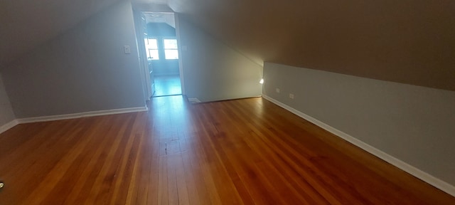 bonus room featuring lofted ceiling and hardwood / wood-style floors