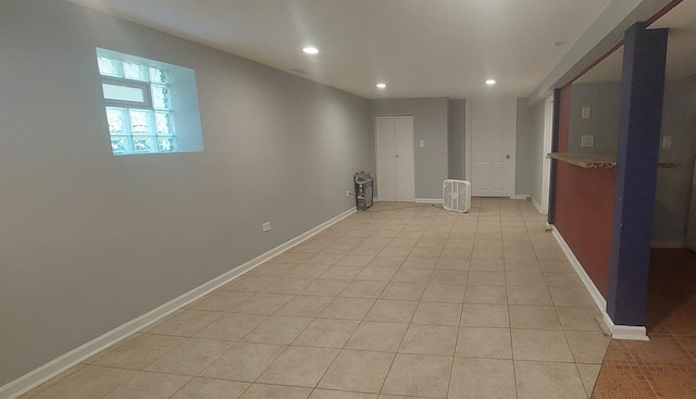 unfurnished room with light tile patterned floors