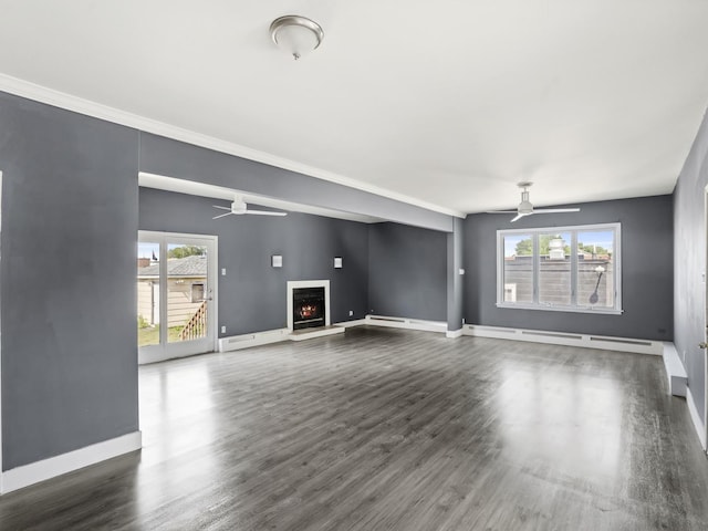 6602 Kennedy Ave, Hammond, IN 46323 - unfurnished living room with a ceiling fan, baseboards, a warm lit fireplace, and dark wood finished floors