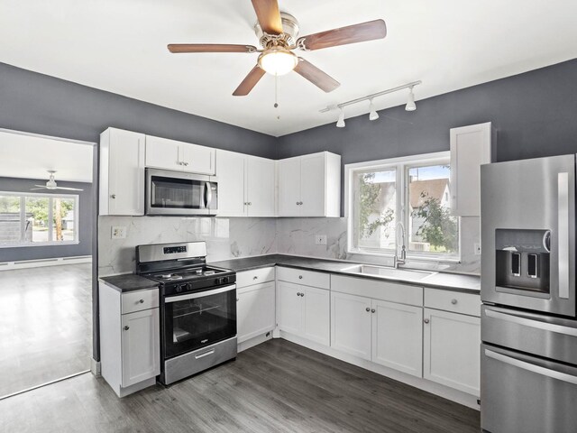 6602 Kennedy Ave, Hammond, IN 46323 - kitchen with appliances with stainless steel finishes, a sink, ceiling fan, and white cabinets