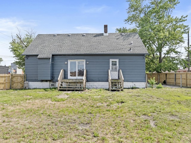 6602 Kennedy Ave, Hammond, IN 46323 - back of property featuring entry steps, a chimney, and a shingled roof