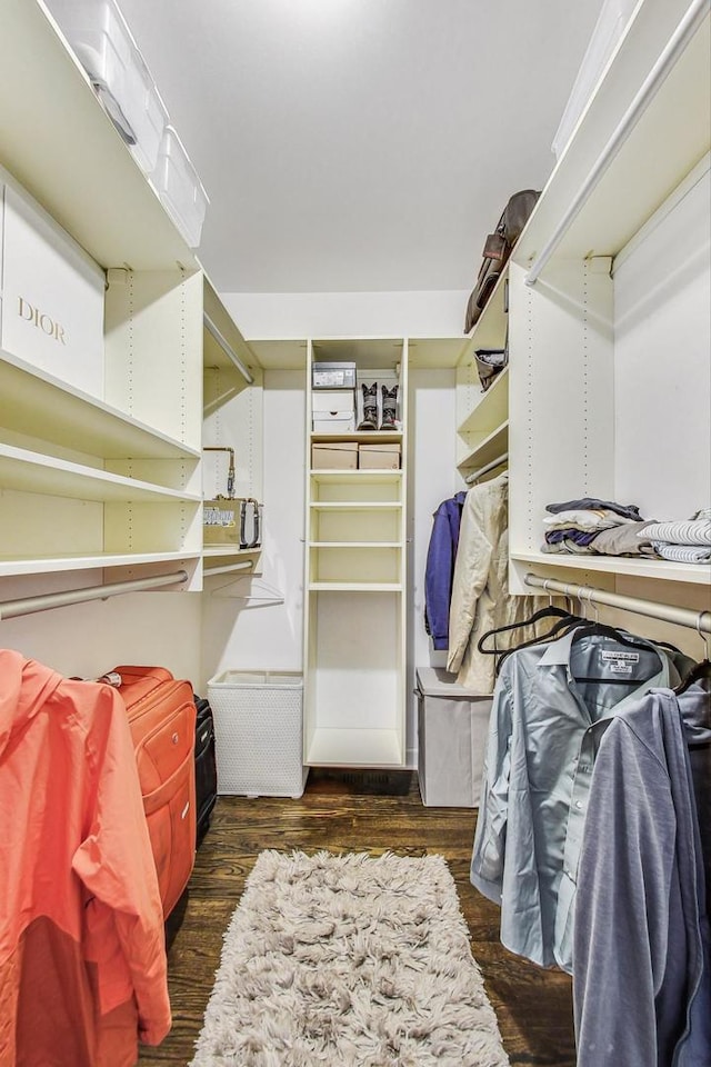 walk in closet featuring dark wood-type flooring