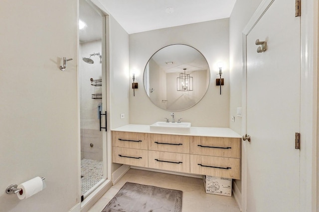 bathroom with tile patterned flooring, vanity, and an enclosed shower