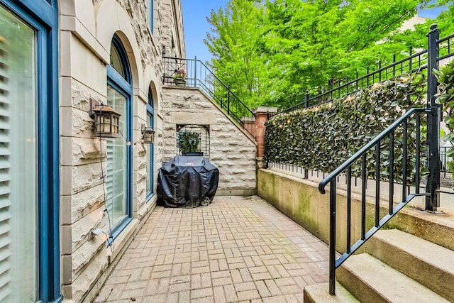 view of patio featuring a grill