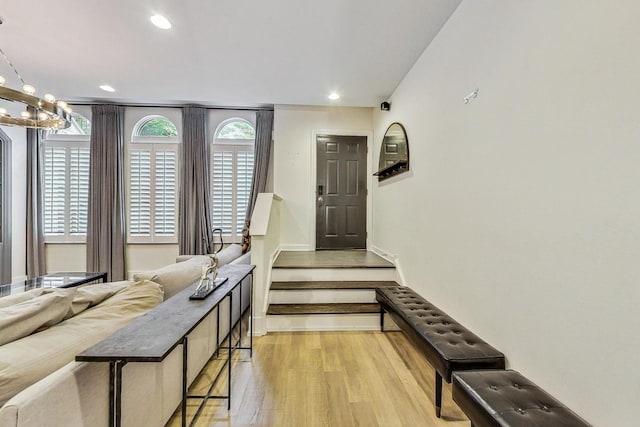 entryway featuring a chandelier and light hardwood / wood-style floors