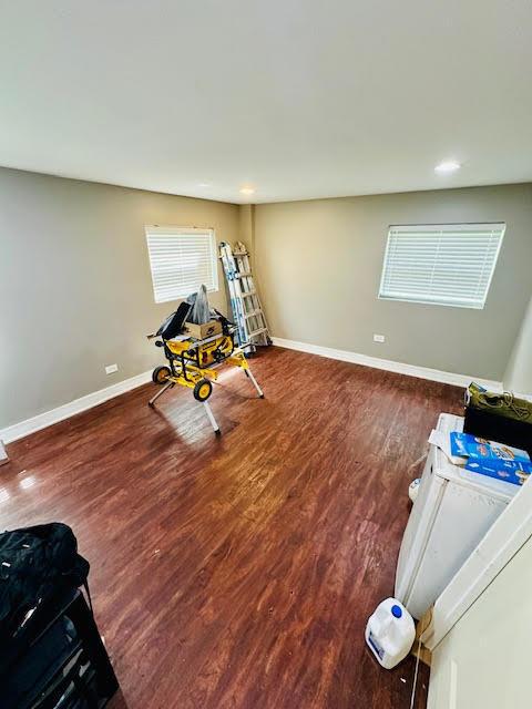 workout area featuring recessed lighting, wood finished floors, and baseboards