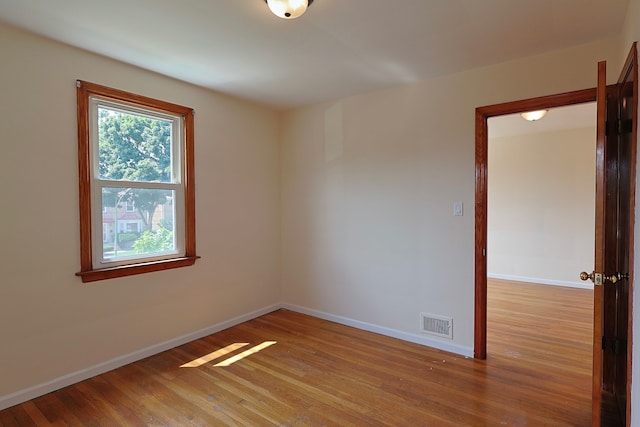 unfurnished room featuring light hardwood / wood-style flooring