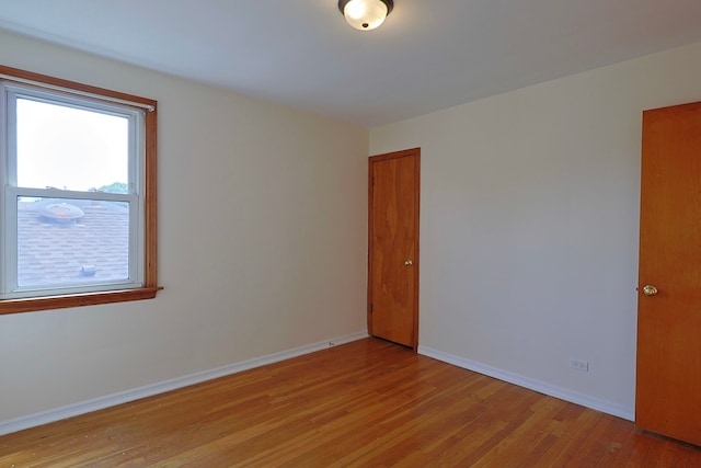 unfurnished room featuring light wood-type flooring