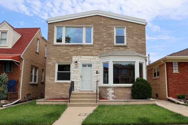 view of front of home featuring a front yard