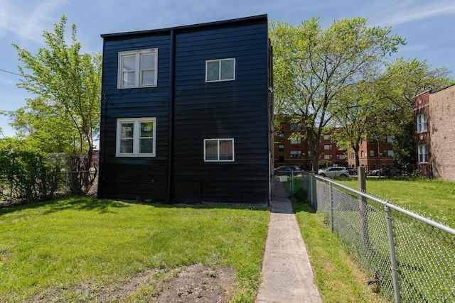 view of home's exterior with a yard