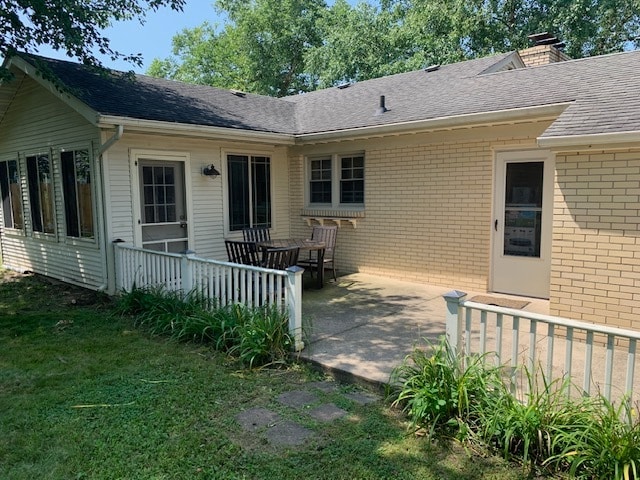 exterior space with a yard and a patio area