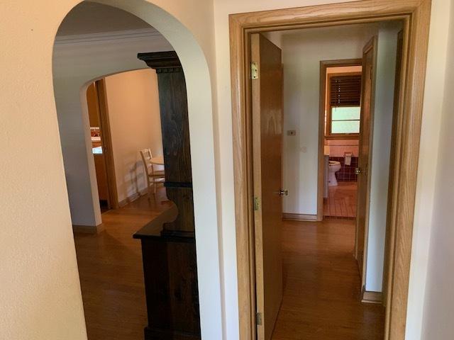 corridor featuring dark hardwood / wood-style flooring