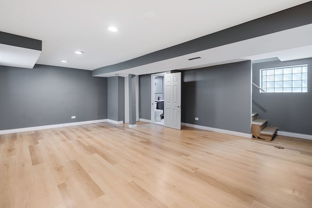 basement featuring light hardwood / wood-style flooring