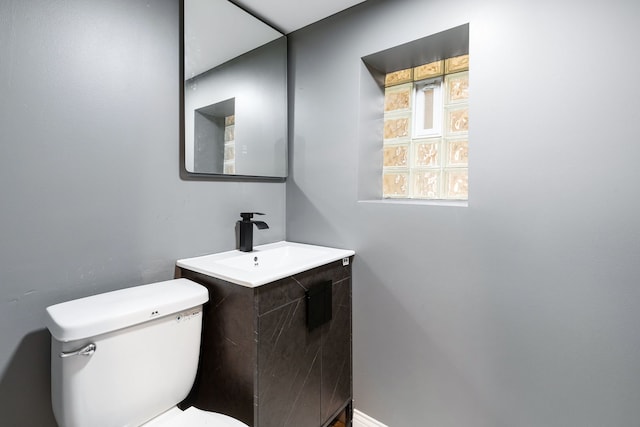 bathroom with toilet and vanity