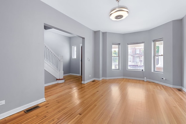 unfurnished room featuring light wood-type flooring