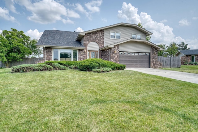 view of front property featuring a garage and a front yard