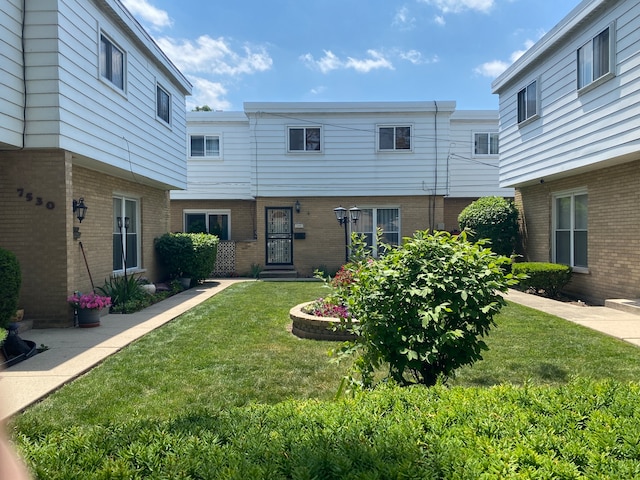 exterior space featuring a front lawn