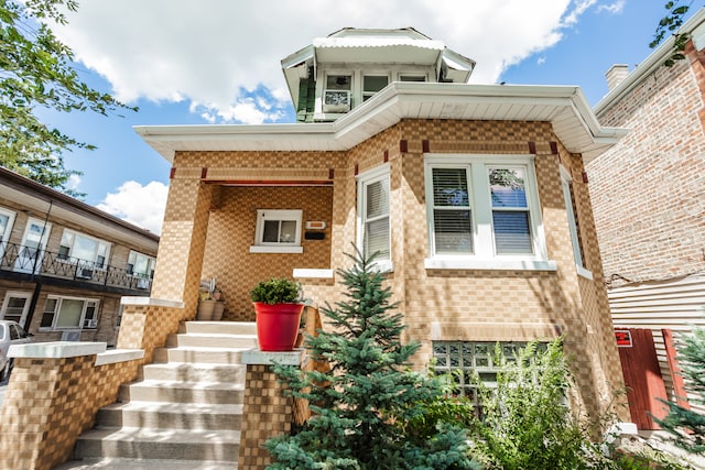 view of front of property with a balcony