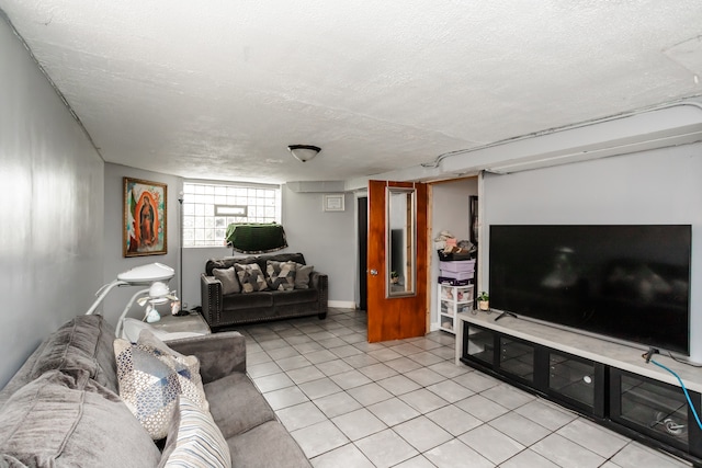 tiled living room featuring a textured ceiling