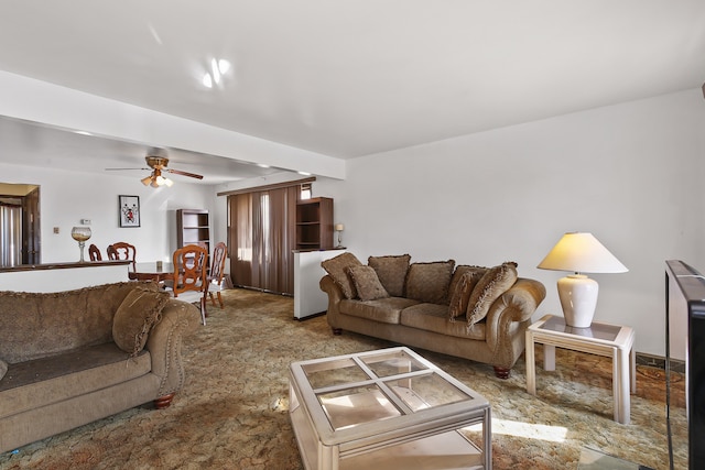 living room featuring carpet floors and ceiling fan