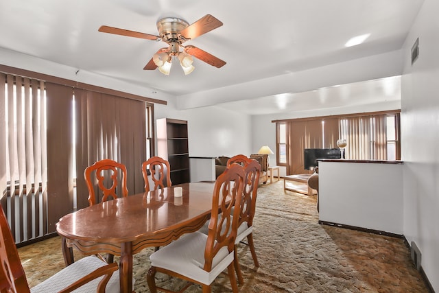 dining room featuring ceiling fan