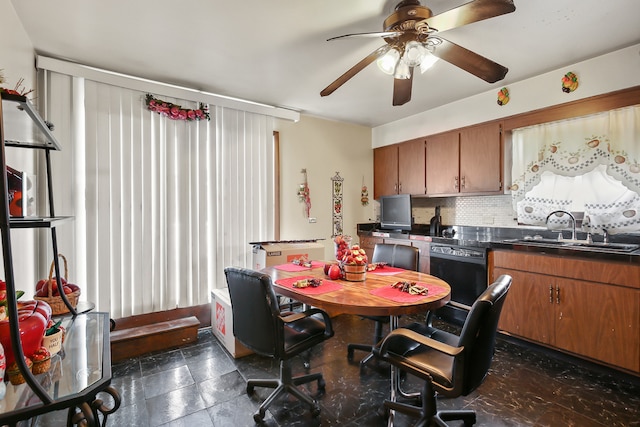 kitchen with dishwasher, tasteful backsplash, sink, and ceiling fan