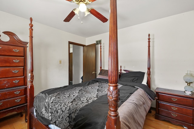 bedroom with light hardwood / wood-style floors and ceiling fan