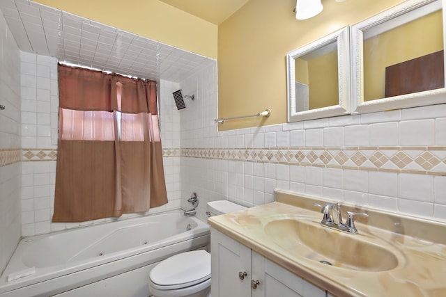 bathroom with tile walls, vanity, toilet, and a bath