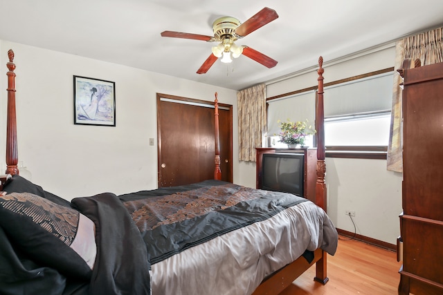 bedroom featuring a closet, light wood-type flooring, and ceiling fan