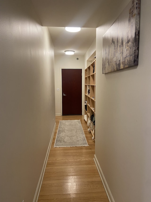 doorway with light wood-type flooring