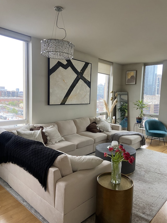 living room with hardwood / wood-style floors and expansive windows