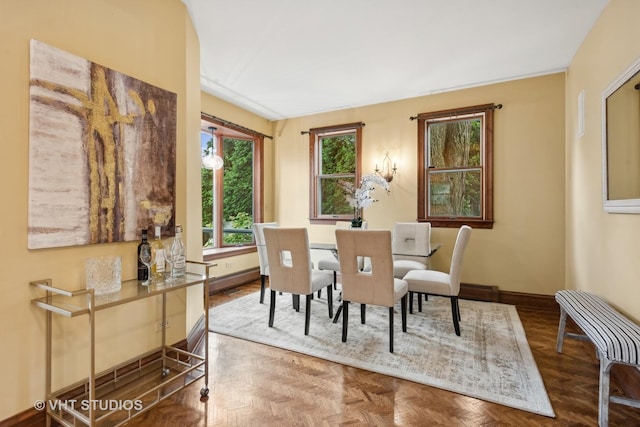 dining space featuring baseboards