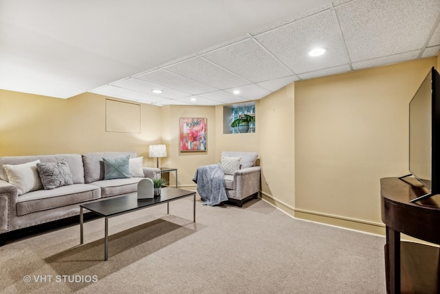 living area with recessed lighting, a paneled ceiling, baseboards, and carpet