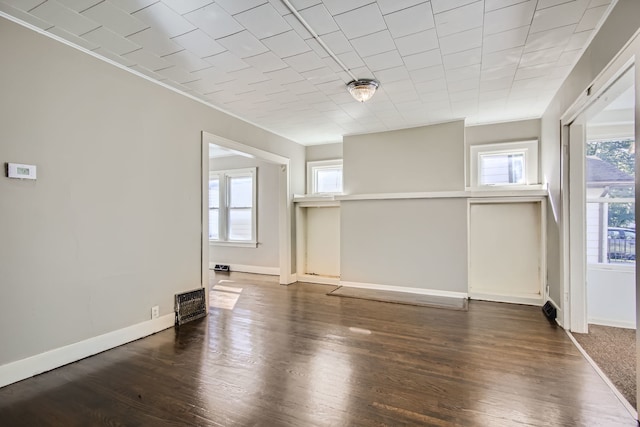 spare room with dark hardwood / wood-style flooring