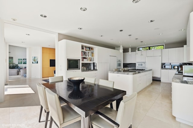 dining room featuring light tile patterned floors