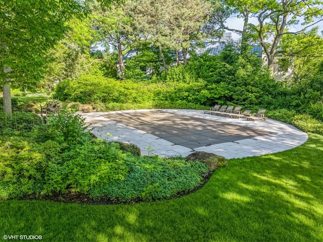 surrounding community featuring a patio area and a yard