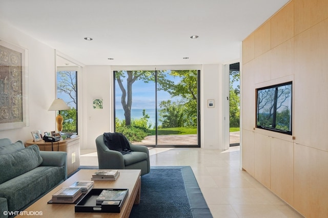 living room featuring floor to ceiling windows